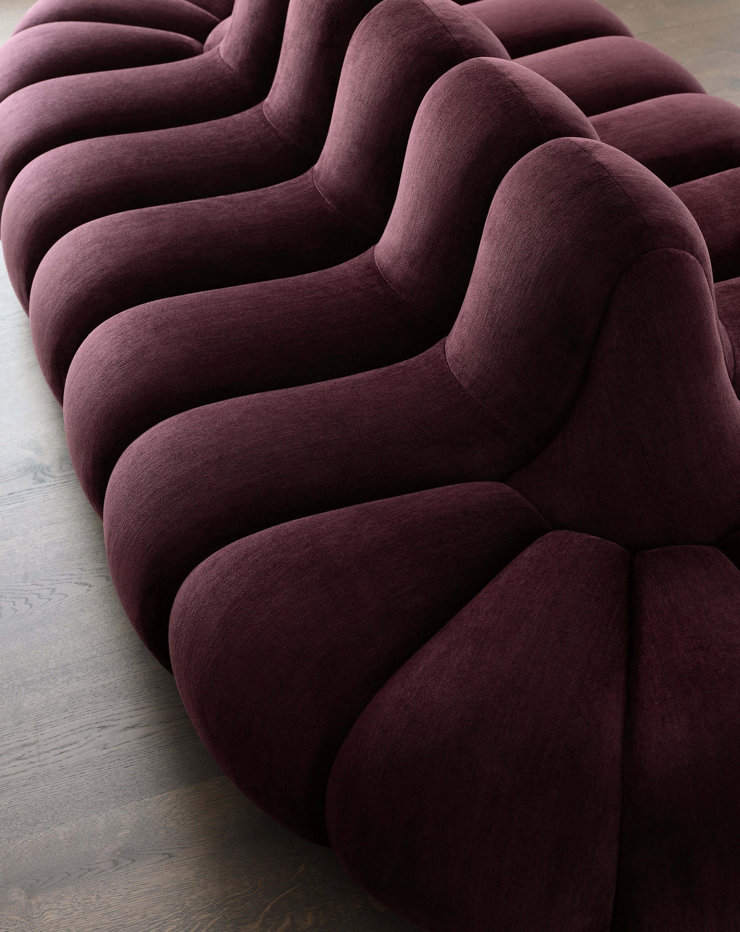 Close-up of the Jagger Lounge Sofa in burgundy Athena fabric.