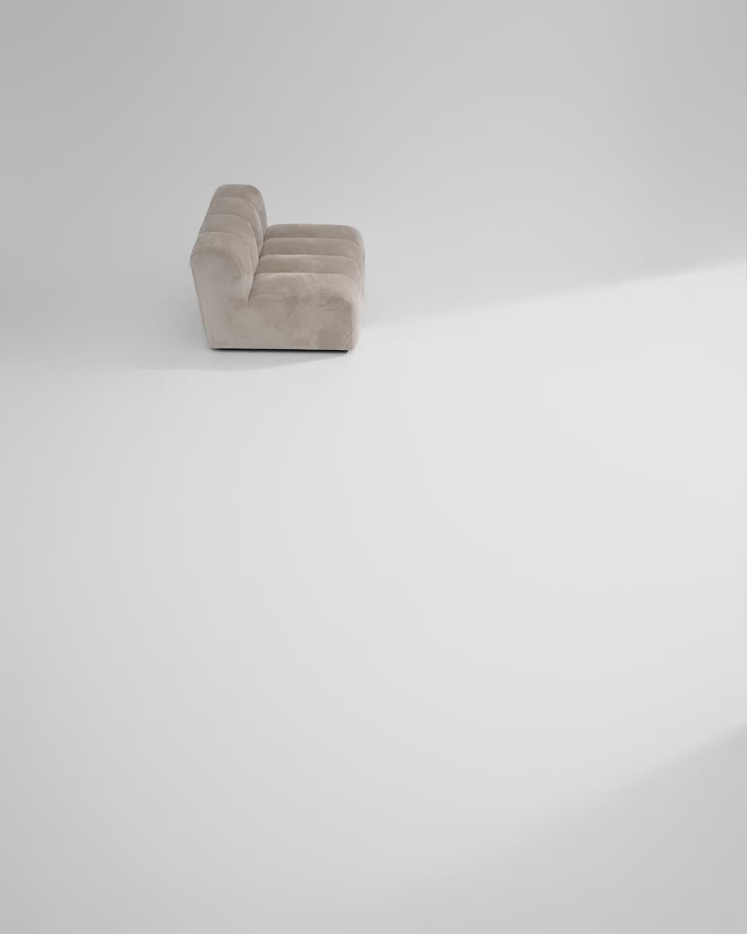 Beige Studio sofa modules are added one at a time next to each other forming a Studio sofa setup 